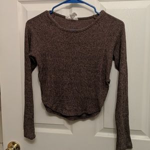 Unique sweater with high cut sides